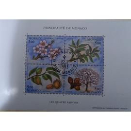 Quatre timbres oblitérés monégasques consacrés aux quatre saisons.